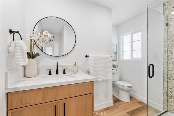 Bathroom, Dual Sink Vanities, Glass Shower, Interior, Wood Texture Flooring