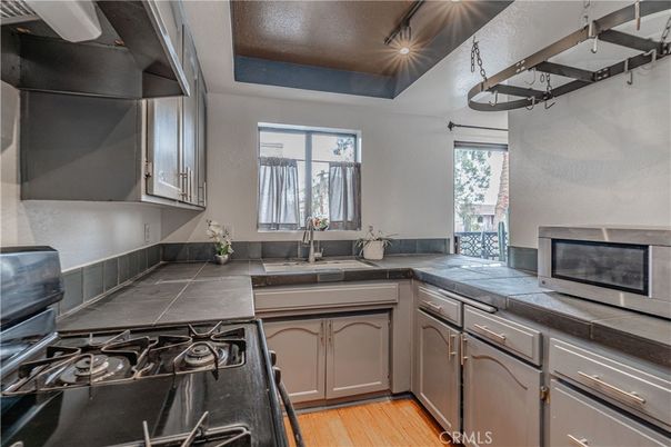 Interior, Kitchen, Tile Countertops, Wood Texture Flooring