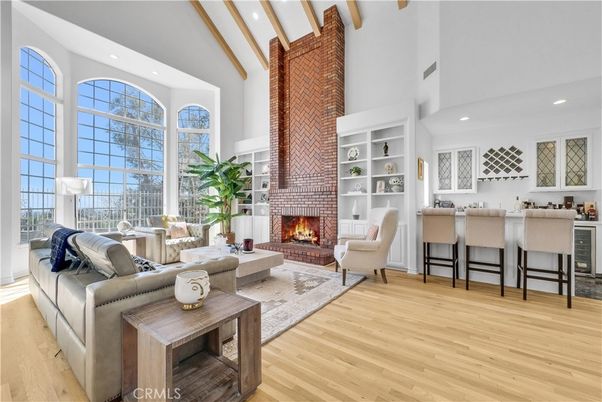 Fireplace, Interior, Living room, Recessed Lighting, Stone Walls, Wood Texture Flooring