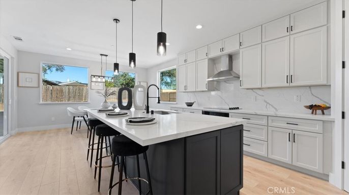 Interior, Kitchen, Marble Walls, Pendant Lights, Recessed Lighting, Stainless Steel Appliances, Wood Texture Flooring