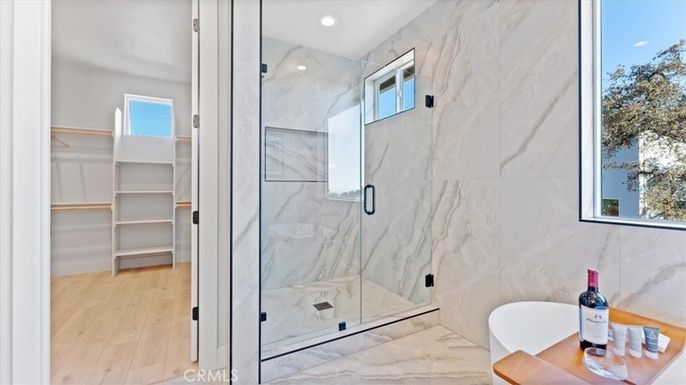 Bathroom, Glass Shower, Interior, Marble Walls, Recessed Lighting, Wood Texture Flooring