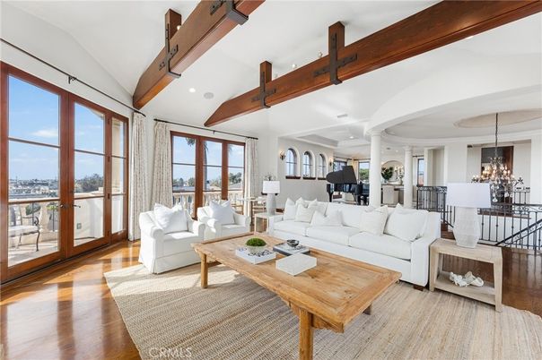 Chandelier, Fireplace, Interior, Living room, Piano, Recessed Lighting, Wooden Beams, Wood Texture Flooring