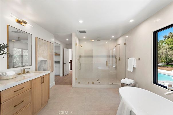 Bathroom, Dual Sink Vanities, Free Standing Baths, Glass Shower, Interior, Recessed Lighting, Wood Texture Flooring