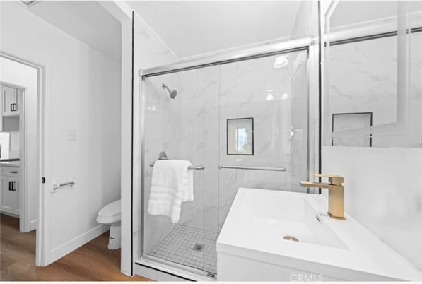 Bathroom, Glass Shower, Interior, Marble Walls, Wood Texture Flooring
