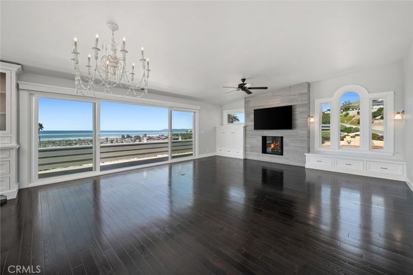 Chandelier, Empty room, Fireplace, Interior, Water, Wood Texture Flooring