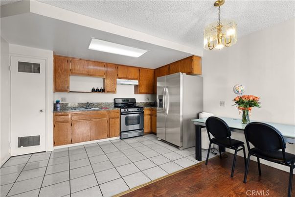 Dining room, Interior, Kitchen, Pendant Lights, Stainless Steel Appliances, Wood Texture Flooring