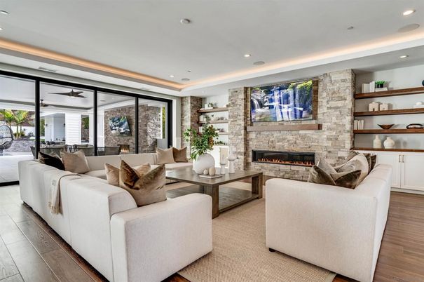 Dining room, Fireplace, Interior, Living room, Recessed Lighting, Stone Walls, Wood Texture Flooring