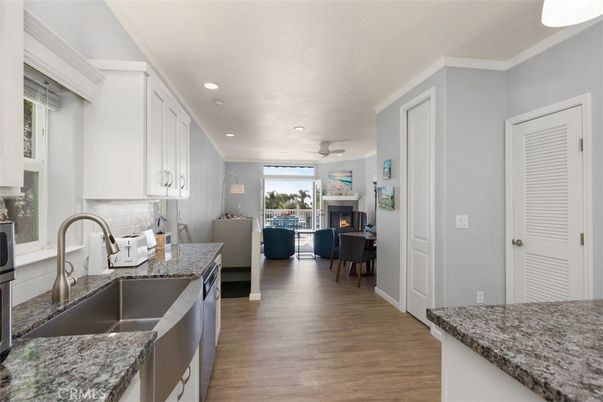 Fireplace, Interior, Kitchen, Living room, Recessed Lighting, Wood Texture Flooring