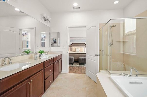 Bathroom, Bedroom, Dual Sink Vanities, Glass Shower, Interior, Recessed Lighting, Wood Texture Flooring