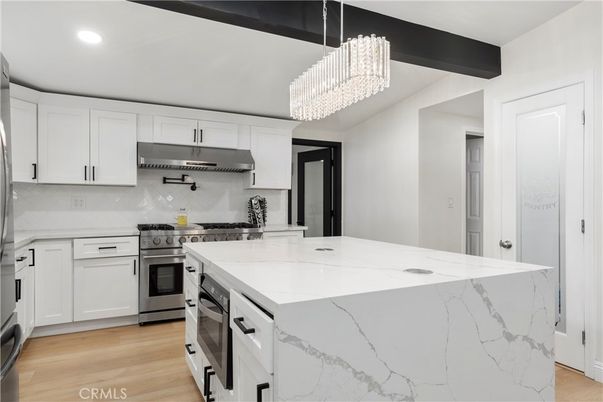 Chandelier, Interior, Kitchen, Recessed Lighting, Stainless Steel Appliances, Wood Texture Flooring