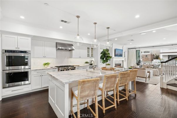 Dining room, Fireplace, Interior, Kitchen, Living room, Pendant Lights, Recessed Lighting, Stainless Steel Appliances, Wood Texture Flooring