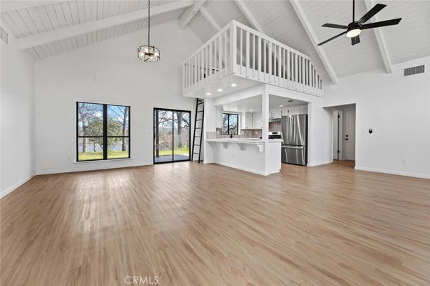 Empty room, Interior, Kitchen, Pendant Lights, Stainless Steel Appliances, Wood Texture Flooring