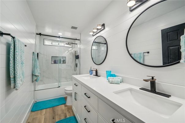 Bathroom, Dual Sink Vanities, Glass Shower, Interior, Recessed Lighting, Wood Texture Flooring
