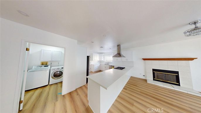 Fireplace, Interior, Kitchen, Recessed Lighting, Washer, Wood Texture Flooring