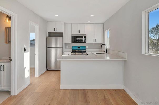Interior, Kitchen, Recessed Lighting, Stainless Steel Appliances, Wood Texture Flooring