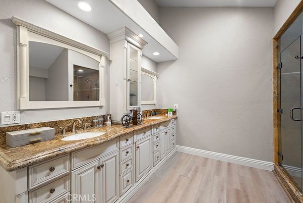 Bathroom, Dual Sink Vanities, Interior, Recessed Lighting, Wood Texture Flooring