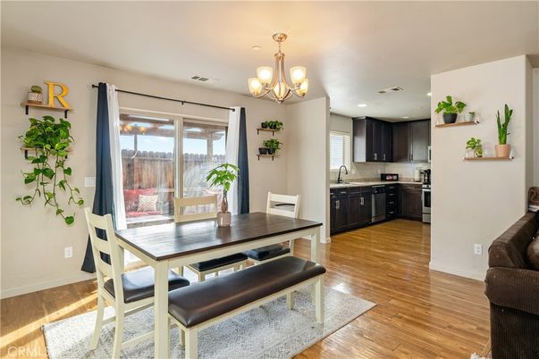 Chandelier, Dining room, Interior, Kitchen, Recessed Lighting, Stainless Steel Appliances, Wood Texture Flooring