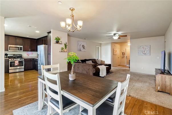 Chandelier, Dining room, Interior, Kitchen, Recessed Lighting, Stainless Steel Appliances, Wood Texture Flooring