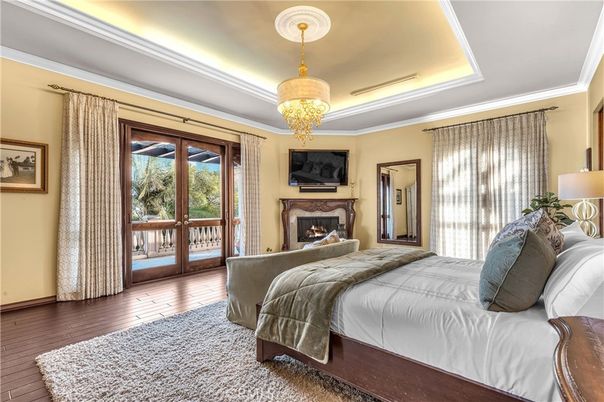 Bedroom, Chandelier, Fireplace, Interior, Wood Texture Flooring