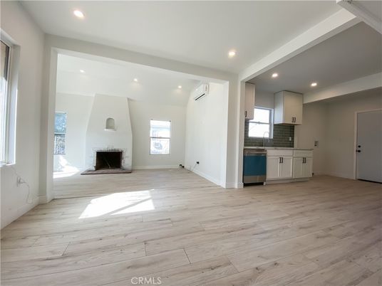 Empty room, Fireplace, Interior, Kitchen, Recessed Lighting, Wood Texture Flooring