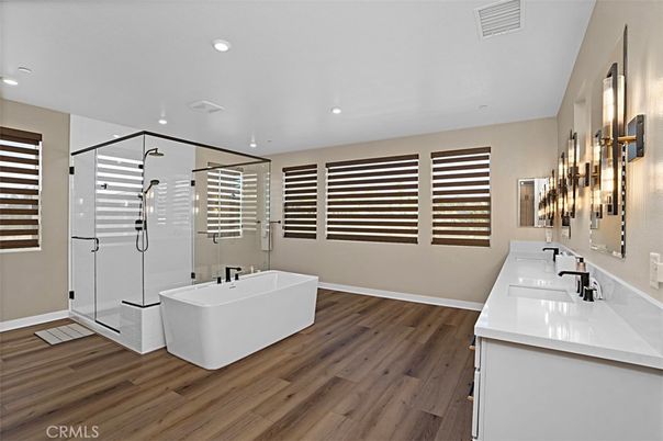 Bathroom, Dual Sink Vanities, Free Standing Baths, Glass Shower, Interior, Recessed Lighting, Wood Texture Flooring