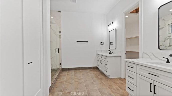 Bathroom, Dual Sink Vanities, Glass Shower, Interior, Marble Walls, Recessed Lighting