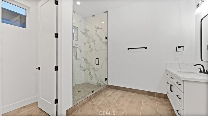Bathroom, Dual Sink Vanities, Glass Shower, Interior, Marble Walls, Recessed Lighting