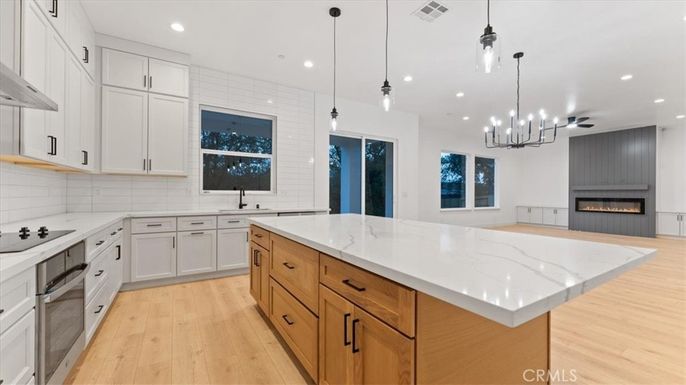 Fireplace, Interior, Kitchen, Pendant Lights, Recessed Lighting, Wood Texture Flooring