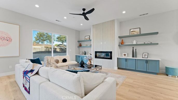 Fireplace, Interior, Living room, Recessed Lighting, Water, Wood Texture Flooring