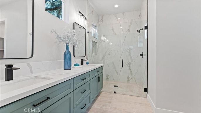 Bathroom, Dual Sink Vanities, Glass Shower, Interior, Marble Walls, Recessed Lighting
