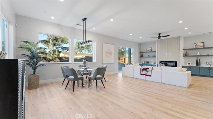 Dining room, Fireplace, Interior, Living room, Pendant Lights, Recessed Lighting, Wood Texture Flooring