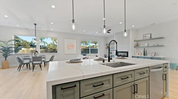 Dining room, Fireplace, Interior, Kitchen, Pendant Lights, Recessed Lighting, Stainless Steel Appliances, Wood Texture Flooring