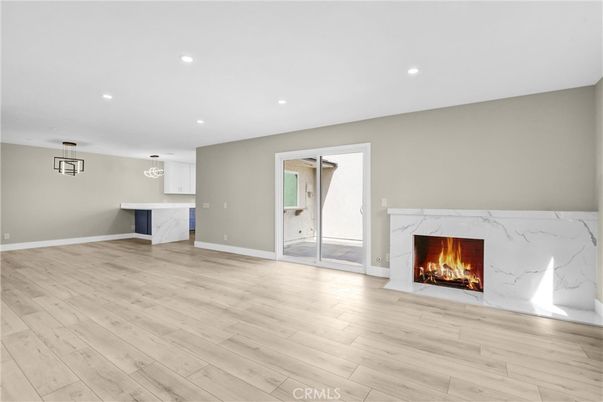 Empty room, Fireplace, Interior, Marble Walls, Pendant Lights, Recessed Lighting, Wood Texture Flooring