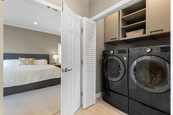 Bedroom, Interior, Recessed Lighting, Utility Closets, Washer, Wood Texture Flooring
