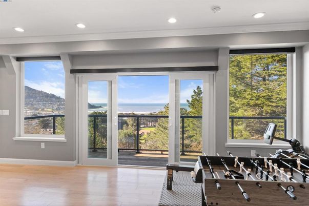 Fitness Equipment, Game Room, Interior, Recessed Lighting, Water, Wood Texture Flooring