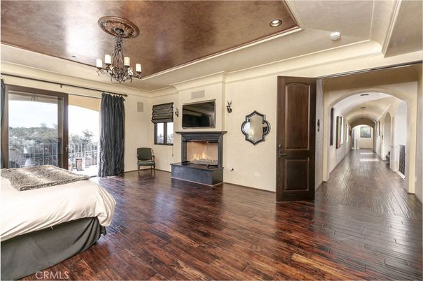 Bedroom, Chandelier, Fireplace, Interior, Recessed Lighting, Wood Texture Flooring