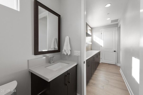 Bathroom, Dual Sink Vanities, Interior, Recessed Lighting, Wood Texture Flooring