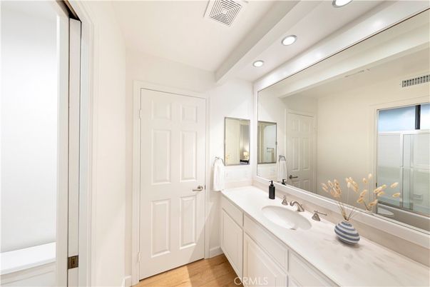 Bathroom, Dual Sink Vanities, Interior, Recessed Lighting, Wood Texture Flooring
