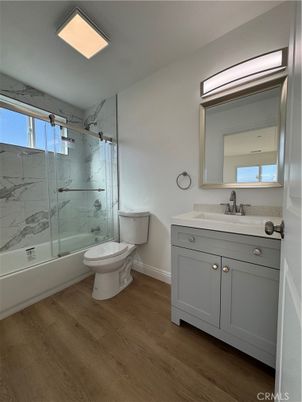 Bathroom, Glass Shower, Interior, Marble Walls, Recessed Lighting, Wood Texture Flooring