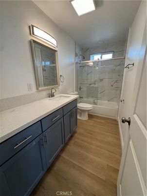 Bathroom, Dual Sink Vanities, Interior, Marble Walls, Wood Texture Flooring