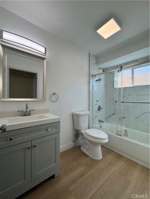 Bathroom, Glass Shower, Interior, Marble Walls, Recessed Lighting, Wood Texture Flooring