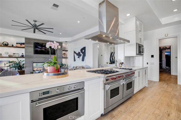 Fireplace, Interior, Kitchen, Recessed Lighting, Stainless Steel Appliances, Wood Texture Flooring