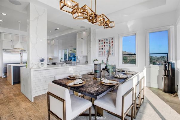 Dining room, Interior, Kitchen, Marble Walls, Pendant Lights, Recessed Lighting, Stainless Steel Appliances, Wood Texture Flooring