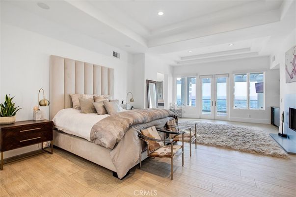 Bedroom, Fireplace, Interior, Recessed Lighting, Water, Wood Texture Flooring