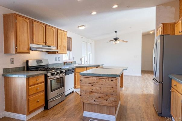 Interior, Kitchen, Recessed Lighting, Tile Countertops, Wood Texture Flooring