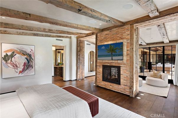 Bedroom, Fireplace, Interior, Recessed Lighting, Stone Walls, Wooden Beams, Wood Texture Flooring