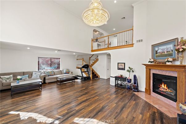 Chandelier, Fireplace, Fitness Equipment, Interior, Living room, Recessed Lighting, Wood Texture Flooring
