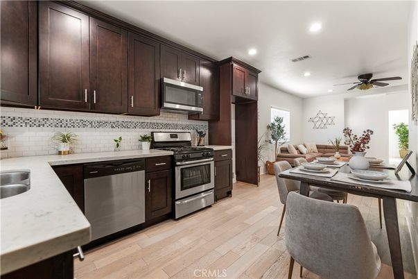 Dining room, Interior, Kitchen, Recessed Lighting, Stainless Steel Appliances, Wood Texture Flooring
