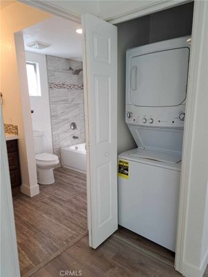 Bathroom, Interior, Marble Walls, Recessed Lighting, Utility Closets, Washer, Wood Texture Flooring
