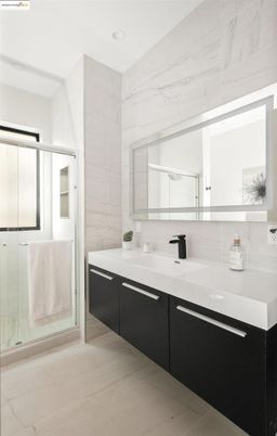 Bathroom, Dual Sink Vanities, Glass Shower, Interior, Marble, Marble Walls, Recessed Lighting